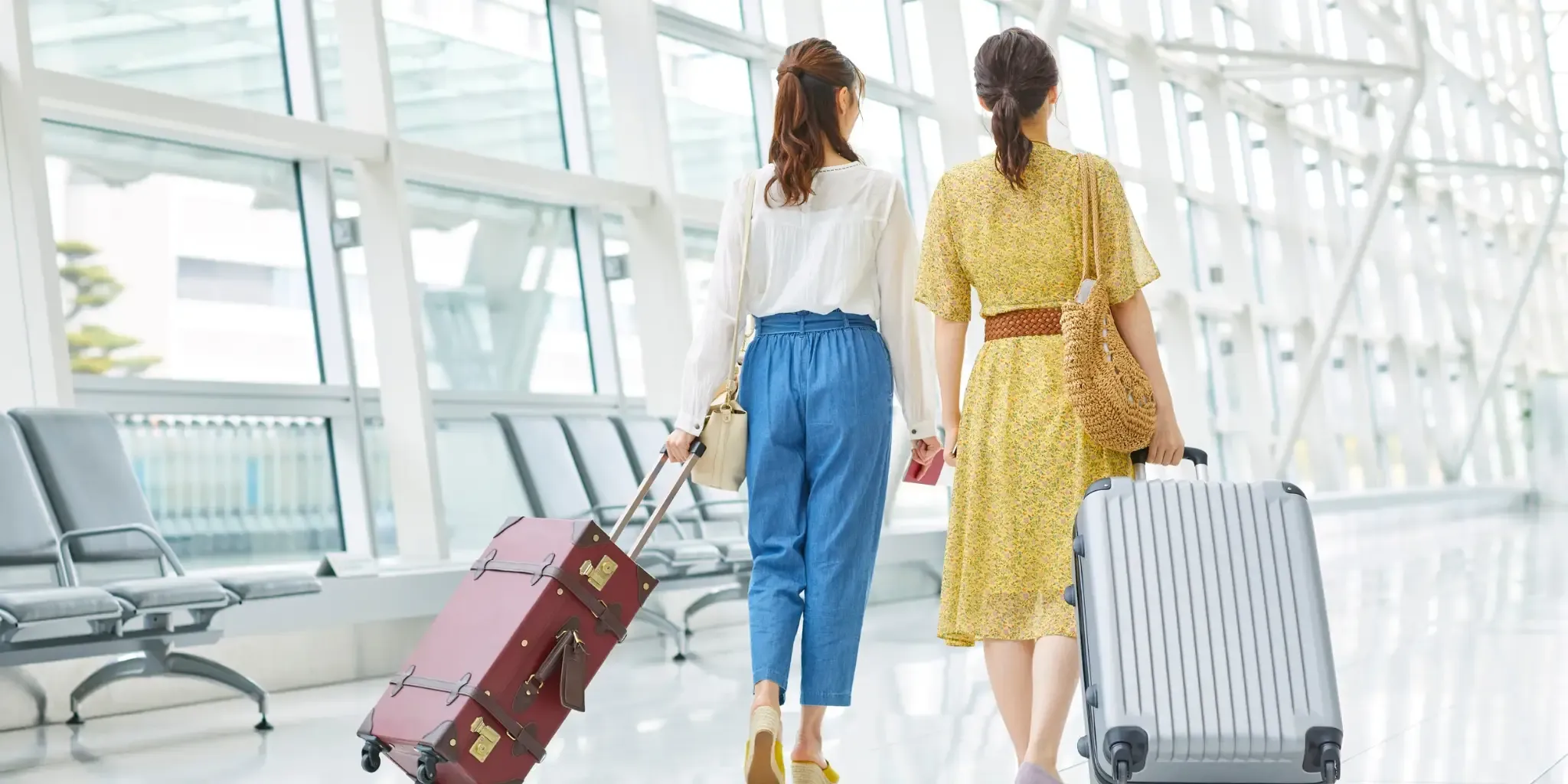 Travellers walk through an airport terminal Travellers walk through an airport terminal